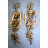 A PAIR OF WOODEN WALL CANDELABRA, craved with foliage. 87 cm long.