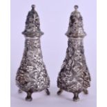 A PAIR OF CONTINENTAL STIEFF SILVER CONDIMENTS repousse decorated with foliage. 5.6 oz. 12 cm high.