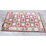 A SMALL RED GROUND TURKISH RUG, decorated with motifs. 140 cm x 102 cm.