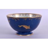 A WEDGWOOD LUSTRE PORCELAIN TEA BOWL painted with swimming amongst reeds. 10 cm diameter.