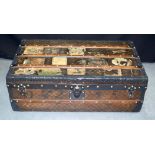 AN ANTIQUE FRENCH LOUIS VUITTON TRAVELLING TRUNK with iron handles and brass stud work, the body