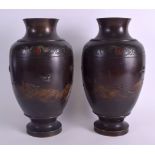 A GOOD PAIR OF 19TH CENTURY JAPANESE MEIJI PERIOD BRONZE VASES decorated with birds and dragons in