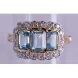 A 9 CT GOLD EMERALD CUT BLUE TOPAZ AND DIAMOND RING. Size Q.