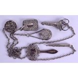 A 19TH CENTURY CONTINENTAL CHATELAINE formed with a scent bottle, pen, clip etc. 6 oz.