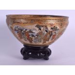 A 19TH CENTURY JAPANESE MEIJI PERIOD SATSUMA POTTERY BOWL painted with figures within landscapes.