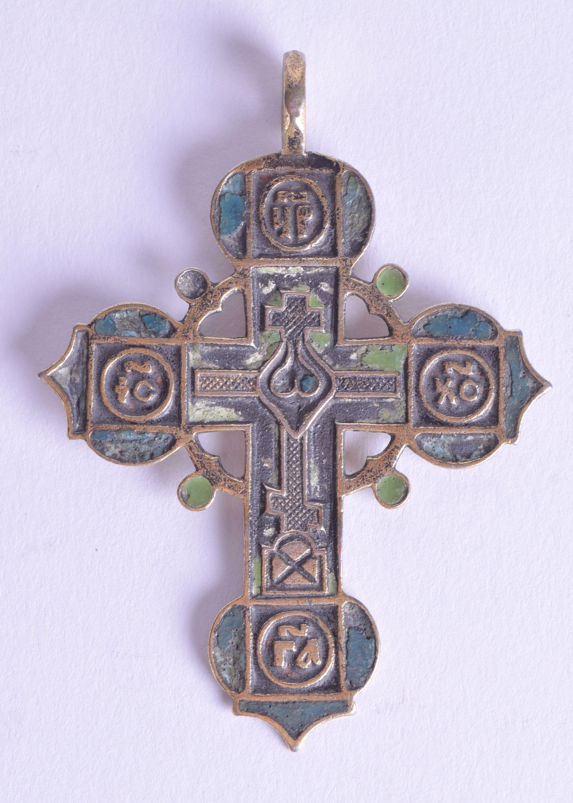 A 17TH/18TH CENTURY GREEK ORTHODOX BRASS AND ENAMEL CRUCIFIX PENDANT decorated with scripture and