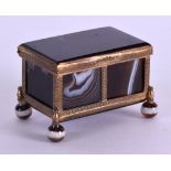 A MID 19TH CENTURY FRENCH GILT METAL AND ONYX PILL BOX. 6 cm x 3.5 cm.