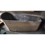 A RUSTIC WOODEN BATH TUB, painted grey. 150 cm long