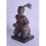 AN EARLY JAPANESE LACQUERED WOOD FIGURE OF A SEATED MALE probably Muromachi period. Figure 16.5 cm x