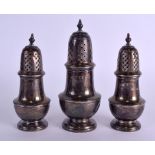 A GROUP OF THREE ANTIQUE ENGLISH SILVER SUGAR CASTERS various dates.15.3 oz. Largest 14.5 cm