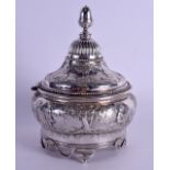 AN 18TH/19TH CENTURY DUTCH SILVER TOBACCO JAR AND COVER decorated with peasants within landscapes.