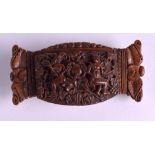 AN EARLY 19TH CENTURY CONTINENTAL CARVED COQUILLA NUT SNUFF BOX decorated with opposing figures