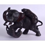 A 19TH CENTURY JAPANESE MEIJI PERIOD BRONZE OKIMONO modelled as an elephant being attacked by two