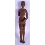 A MID 19TH CENTURY ARTICULATED WOODEN FIGURE modelled as a standing male. 34 cm high.