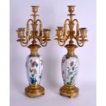 A GOOD PAIR OF 19TH CENTURY FRENCH ORMOLU FIVE BRANCH CANDELABRAS formed with Chinese Kangxi