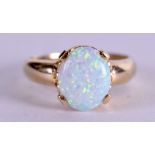 A 14CT GOLD AND OPAL RING. Size R.