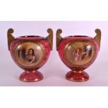 A PAIR OF 19TH CENTURY BOHEMIAN TWIN HANDLED GLASS VASES painted with panels of figures within