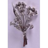 A STYLISH EDWARDIAN PLATINUM AND DIAMOND FLORAL BAR BROOCH of naturalistic form. 8 grams. 4.5 cm x