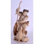 A FINE 19TH CENTURY JAPANESE MEIJI PERIOD CARVED IVORY OKIMONO modelled as a male archer attacking a