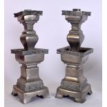 A PAIR OF CHINESE PEWTER CANDLESTICKS, decorated with foliate banding. 34 cm high.
