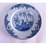 AN 18TH CENTURY DELFT BLUE AND WHITE CIRCULAR TIN GLAZED DISH painted with a fenced garden. 22.5