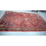 AN EARLY 20TH CENTURY PERSIAN ABEDEH RUG, tightly woven with short pile, decorated with extensive