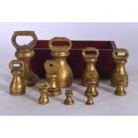 A SET OF GRADUATED BRASS AVERY WEIGHTS, together with a group of smaller weights. (qty)