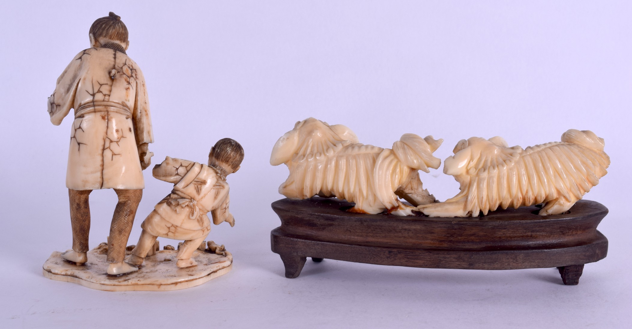 A 19TH CENTURY CHINESE CARVED IVORY DOUBLE BUDDHIST LION GROUP together with a Meiji period ivory - Image 2 of 3