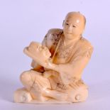 A SMALL 19TH CENTURY JAPANESE MEIJI PERIOD CARVED IVORY OKIMONO modelled as a male holding a noh