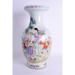 A LARGE 19TH CENTURY CHINESE FAMILLE ROSE BALUSTER VASE painted with figures within an iron red