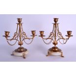 A PAIR OF LATE 19TH CENTURY FRENCH GILT METAL TRIPLE BRANCH CANDELABRAS decorated with floral