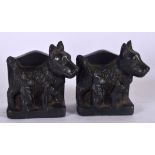 A PAIR OF METAL BOOKENDS, in the form of Scottie dogs. 10 cm wide.