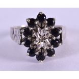 AN ANTIQUE WHITE GOLD DIAMOND AND SAPPHIRE RING. Size N/O.