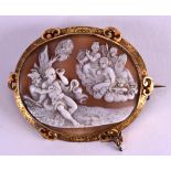 A GOOD 19TH CENTURY CARVED CAMEO BROOCH decorated with figures, within an engraved yellow metal