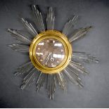 A WALL CLOCK, with faux glass decoration. 63 cm wide.