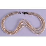 A CULTURED PEARL NECKLACE in fitted case. 40 cm long overall.