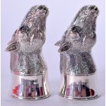 A PAIR OF SOLID SILVER CONDIMENTS, in the form of donkey heads. 7.5 cm high.