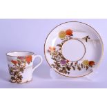 A LATE 19TH CENTURY JAPANESE MEIJI PERIOD SATSUMA TEACUP AND SAUCER by Kinkozan, painted with floral