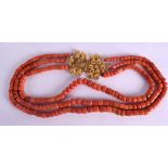 AN 18CT GOLD THREE STRAND RED CORAL NECKLACE. 151 grams. 30 cm long.