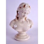 A RARE IRISH KILLARNEY BELLEEK PORCELAIN BUST OF A FEMALE modelled upon a circular plinth. 28 cm x