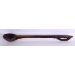 A LATE 19TH CENTURY AFRICAN TRIBAL CARVED WOOD SPOON with engraved terminal. 54 cm long.