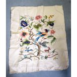 AN EARLY 20TH CENTURY EMBROIDERED PANEL, depicting a bird amongst foliage. 70 cm x 56 cm.