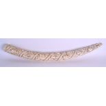 A LARGE 19TH CENTURY AFRICAN CARVED IVORY TRIBAL LOANGO TUSK decorated with figures in various