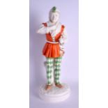 A LARGE CZECH FIGURE OF A STANDING MALE JESTER modelled in brightly coloured