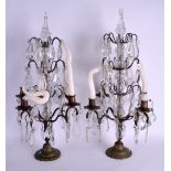 A PAIR OF ANTIQUE CONTINENTAL GIRANDOLE CANDLESTICKS with glass prism drops. 57 cm x 28 cm.