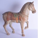 A LARGE 19TH CENTURY INDIAN PAINTED WOODEN FIGURE OF A HORSE modelled with one leg raised. 56 cm x