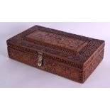 A MID 19TH CENTURY ANGLO INDIAN COLONIAL CARVED WOODEN CASKET decorated with Eastern figures roaming