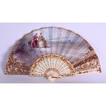 A LATE 19TH CENTURY EUROPEAN IVORY AND SILK LANDSCAPE FAN French or Italian, painted with lovers and