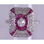 AN ART DECO STYLE DIAMOND AND RUBY RING. Size O.
