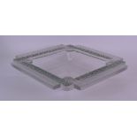 AN ART DECO FRENCH RENE LALIQUE SQUARE FORM DISH decorated with floral roundels. 25.5 cm x 25.5 cm.